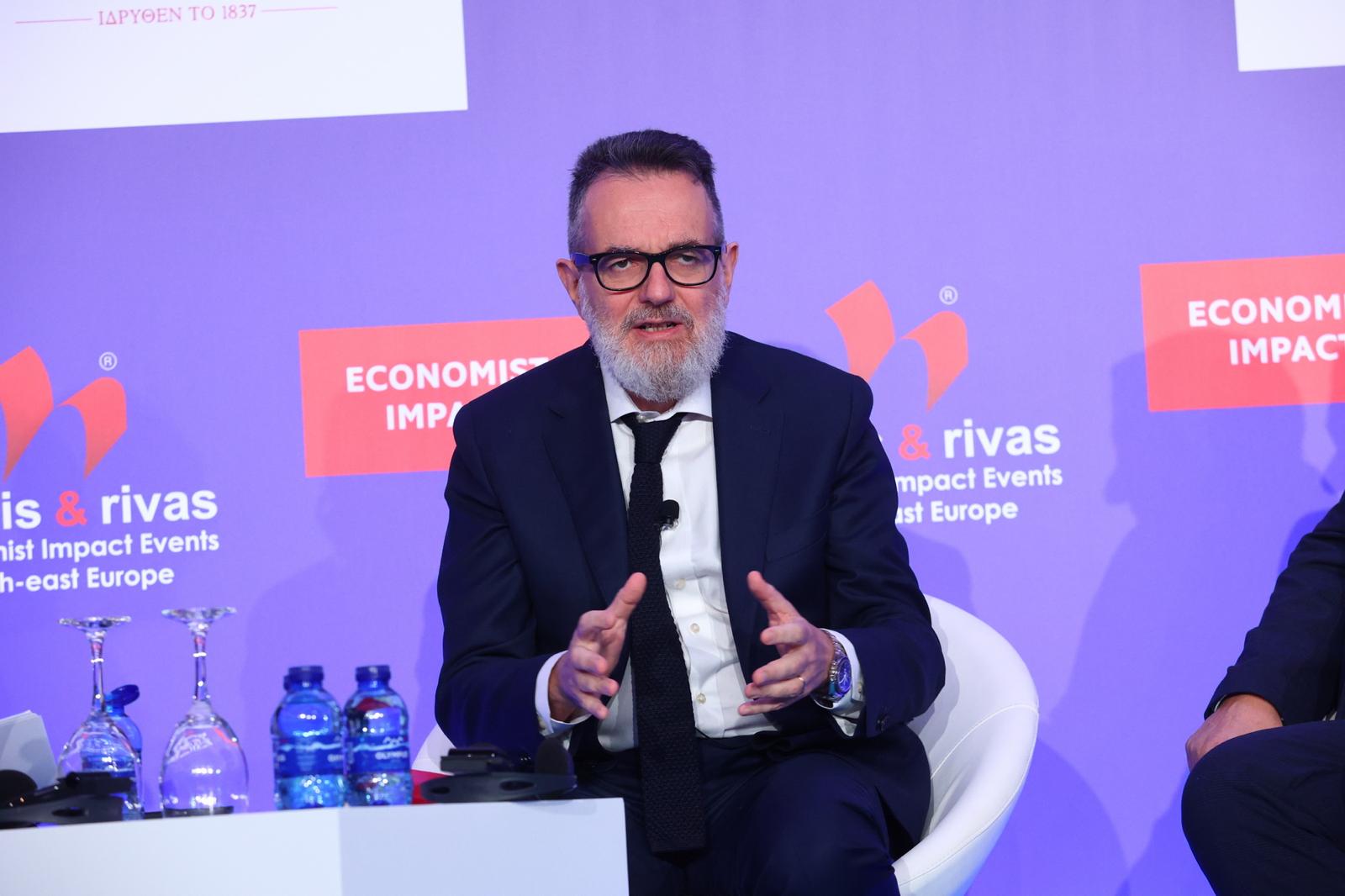 Professor Simone Cipriani speaking at an Economist Impact conference in South-east Europe